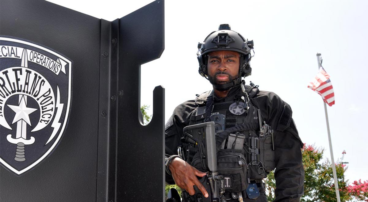 Tactical NOPD police officer facing forward