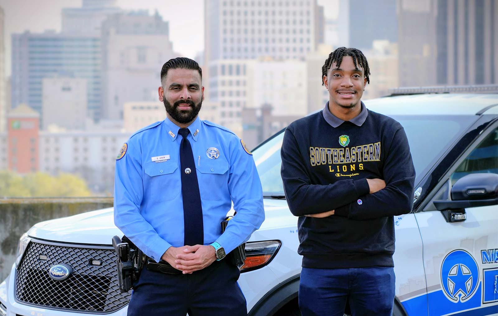 Student internship participant with nopd officer